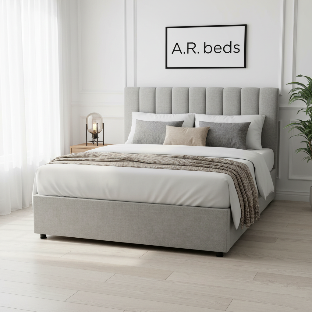 Gray upholstered bed with white bedding in a bright bedroom setting, featuring A.R. beds branding. UK beds 